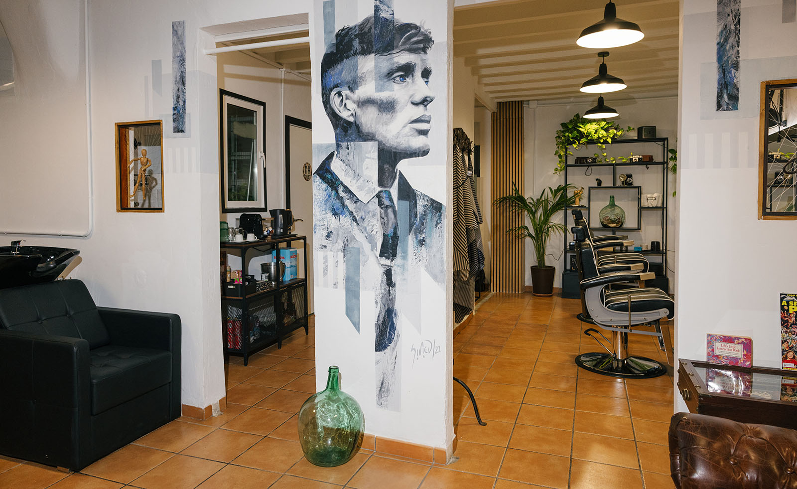 Short Cuts Barbershop interior with Peaky Blinders mural and barber chairs