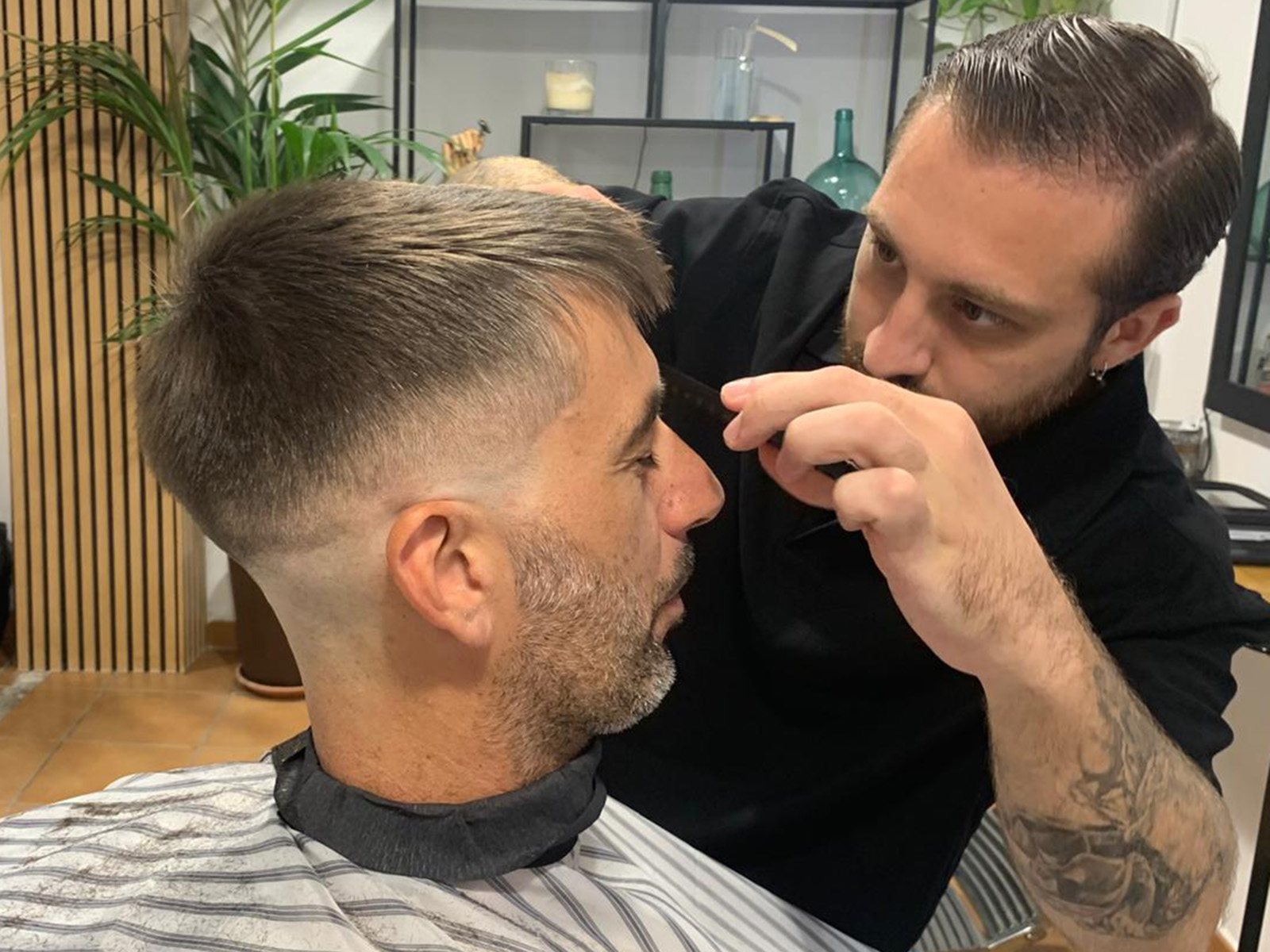 Client haircut finished at the Short Cuts Barbershop chair