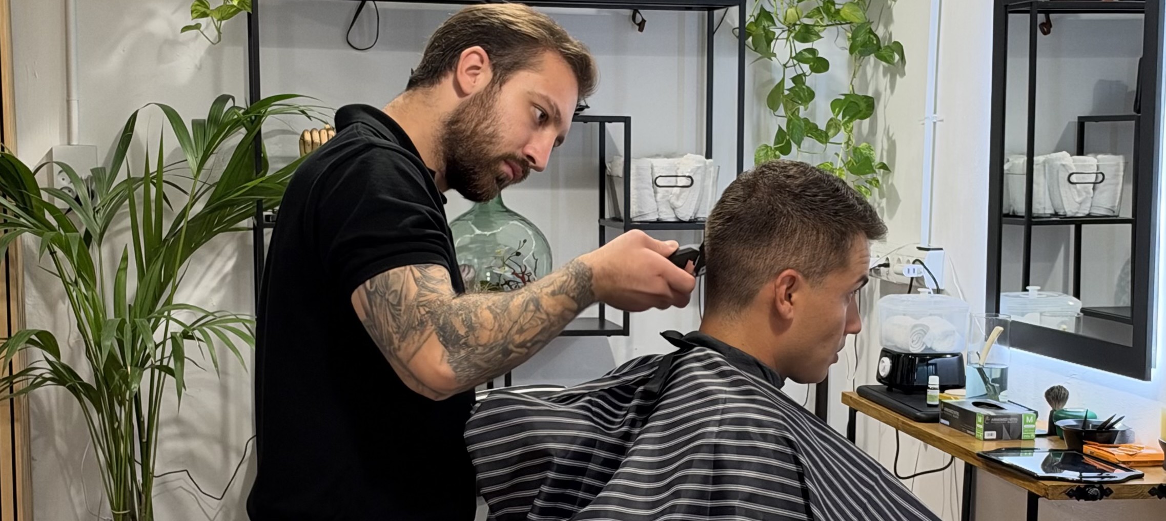 Sergi finishing a cut at the Short Cuts Barbershop chair